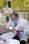 بررسی اثر کوتاه کردن سطح اکلوزال با توجه به شرایط پیش از درمان بر درد بعد از آماده سازی کانال در درمان ریشه دندان