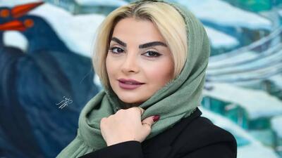 تصویر روز | عاشقانه های  احمد مهران فر  و همسرش در اختتامیه نمایشگاه سوی دیگر - گلی شی