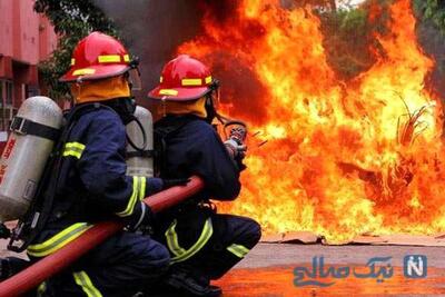 آتش‌سوزی مهیب یک ساختمان در میدان امام حسین تهران / خودروهای لوکس شعله ور شدند