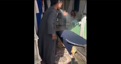 اتو کردن لباس های مردم با آب دهان در مصر!