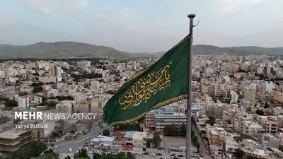 آئین استقبال و برافراشته شدن پرچم رضوی در کرمانشاه