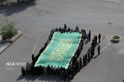اهتزاز پرچم حرم مطهر امام رضا (ع) در خراسان‌شمالی