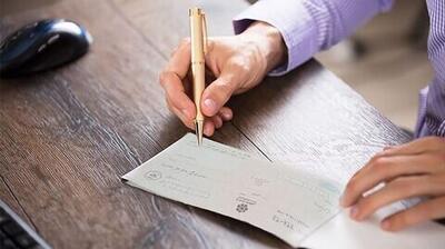 الزام صادرکننده چک به تأمین بیش از کسری مبلغ چک در زمان رفع سوءاثر تخلف است