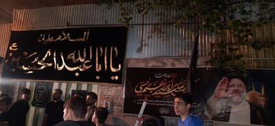 عکسی از تجلیل از مادر شهید رئیسی در یک جشنواره