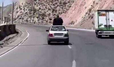 بدلکاری خانم چادری روی سقف پراید+ فیلم