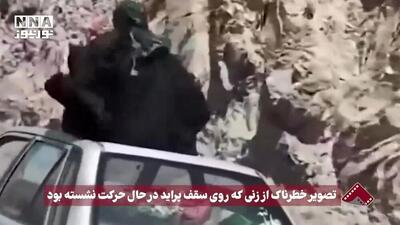 حضور وحشتناک نشستن زنی با چادر روی سقف پراید / فیلم