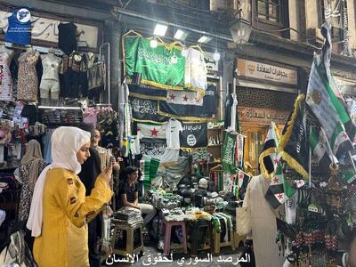 عکس/ فروش علنی پرچم‌ داعش در دمشق