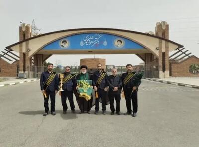 پرچم گردانی حرم حضرت معصومه در سایت فردو