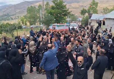 باران گلبرگ‌های سرخ بر پیکر شهید زندان اوین - تسنیم