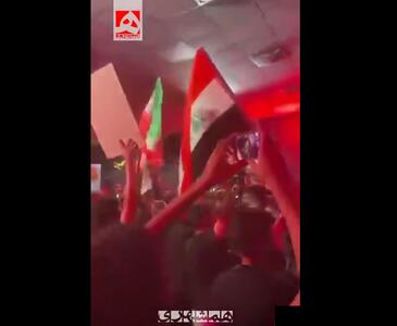 رجزخوانی عراقی‌ها با پرچم ایران و سلاح در دست | ویدئو
